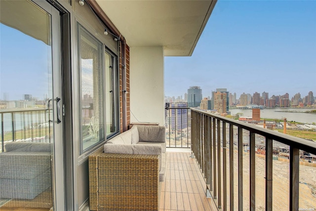 balcony featuring a water view