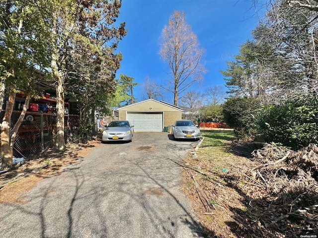 view of front of home with an outbuilding and a garage