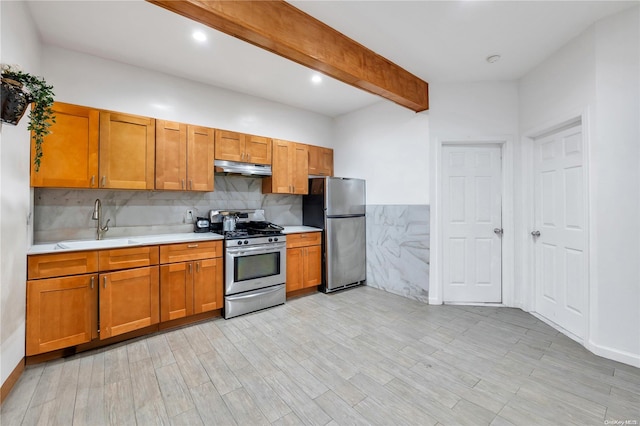 kitchen with sink, beamed ceiling, backsplash, appliances with stainless steel finishes, and light wood-type flooring