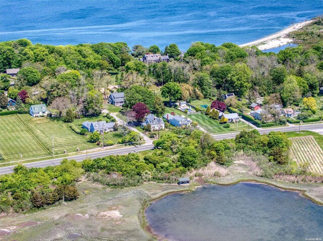 birds eye view of property featuring a rural view and a water view