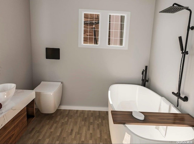 bathroom featuring a bathing tub, wood-type flooring, and toilet