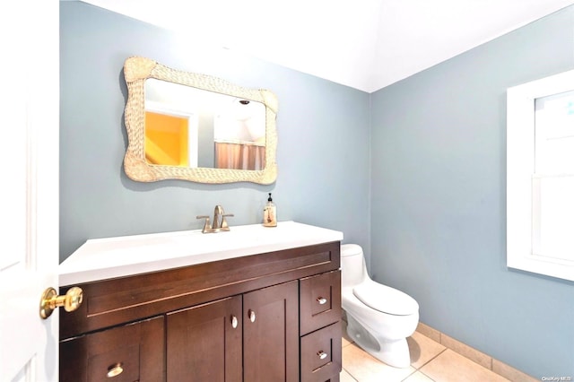 bathroom featuring tile patterned floors, vanity, and toilet