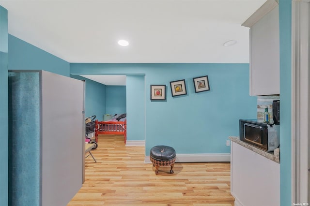 hall featuring light wood-type flooring