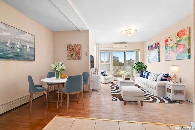 living room featuring light hardwood / wood-style flooring, a baseboard radiator, and a wall mounted air conditioner