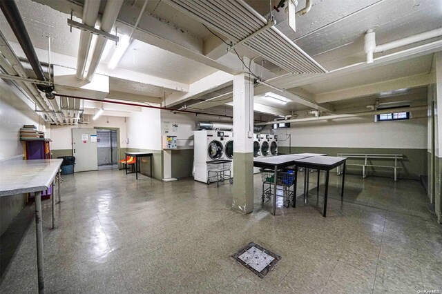 basement with washer and clothes dryer