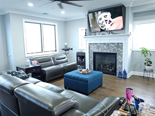 47 Pershing Ave, Babylon, NY 11702 - living area featuring ceiling fan, ornamental molding, plenty of natural light, wood finished floors, and a fireplace