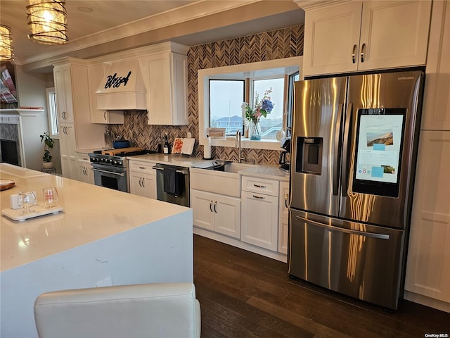 47 Pershing Ave, Babylon, NY 11702 - kitchen featuring appliances with stainless steel finishes, custom exhaust hood, a sink, dark wood-type flooring, and white cabinets