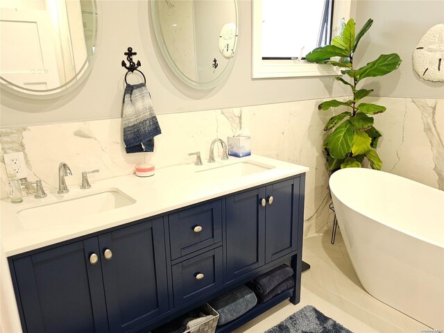 47 Pershing Ave, Babylon, NY 11702 - full bathroom featuring a soaking tub and double vanity