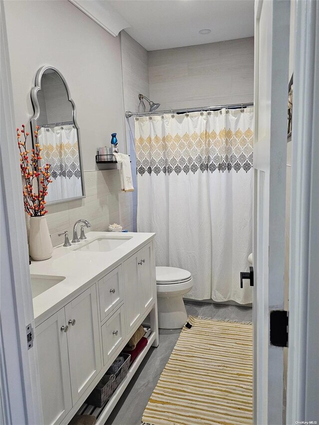 47 Pershing Ave, Babylon, NY 11702 - bathroom featuring toilet, double vanity, and a shower with curtain