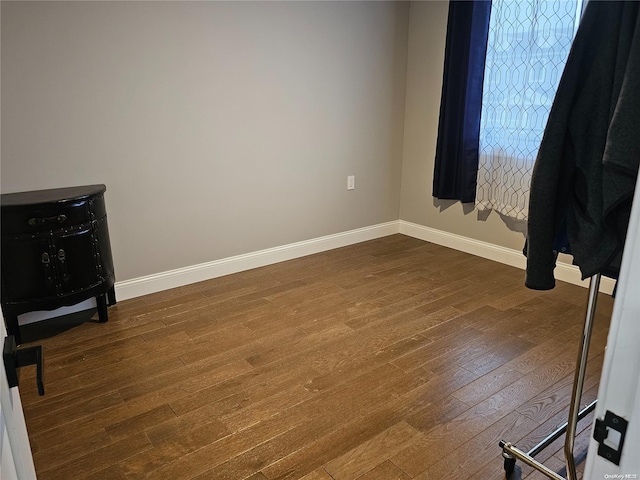 spare room with hardwood / wood-style flooring