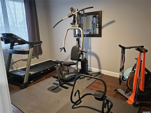 workout room with dark hardwood / wood-style floors