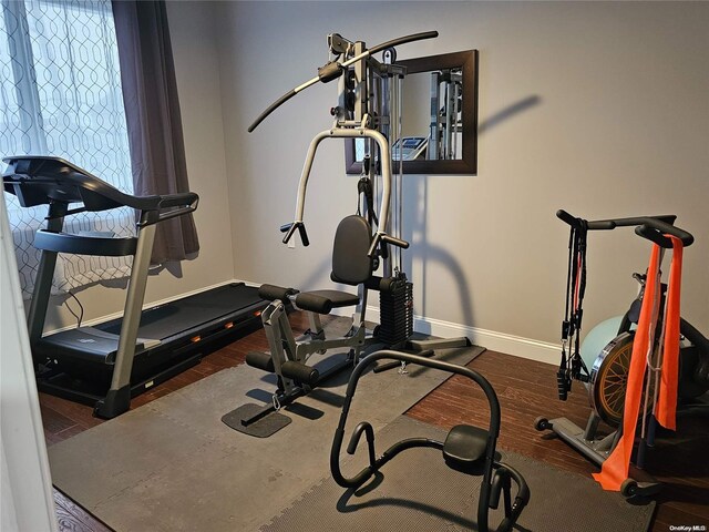 47 Pershing Ave, Babylon, NY 11702 - workout area with baseboards and wood finished floors