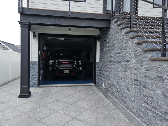 47 Pershing Ave, Babylon, NY 11702 - property entrance with a garage
