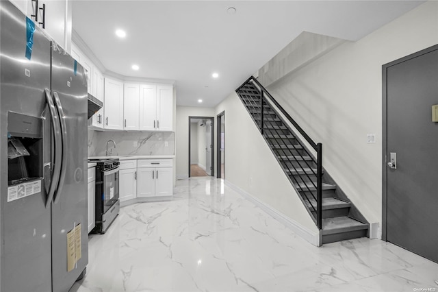 kitchen featuring white cabinets, decorative backsplash, black range oven, and stainless steel refrigerator with ice dispenser