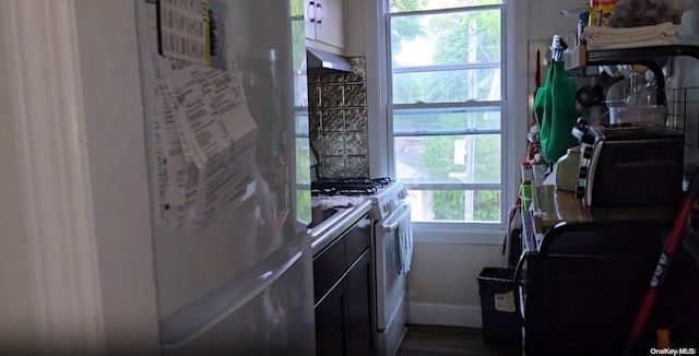 kitchen featuring fridge and gas range gas stove