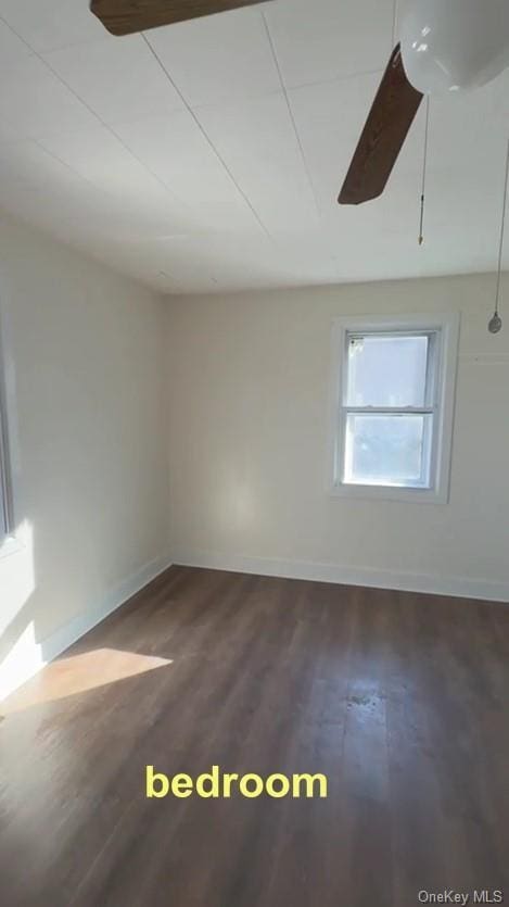 spare room featuring dark hardwood / wood-style floors