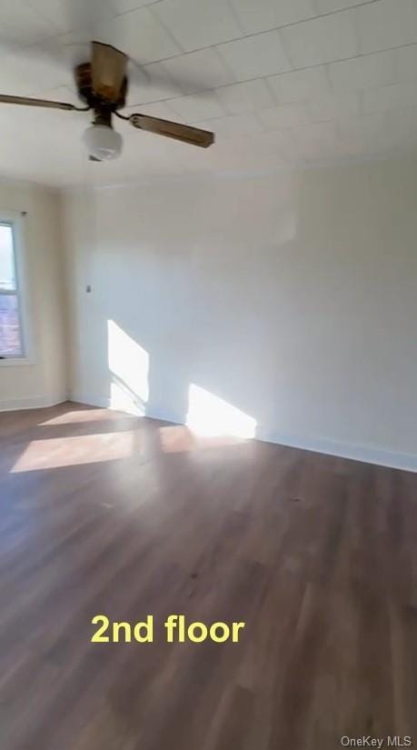 unfurnished room featuring ceiling fan and hardwood / wood-style flooring