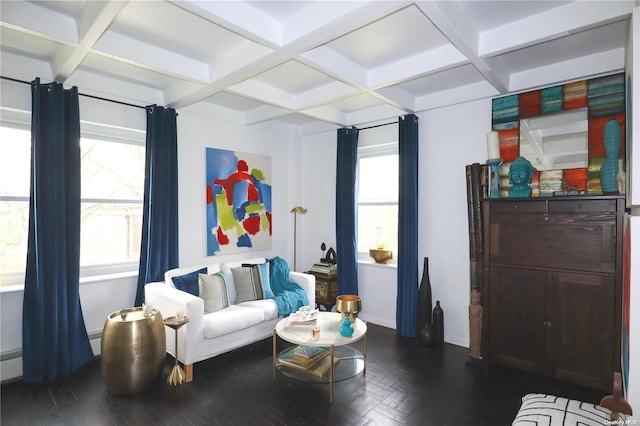 living area featuring plenty of natural light, beamed ceiling, and coffered ceiling