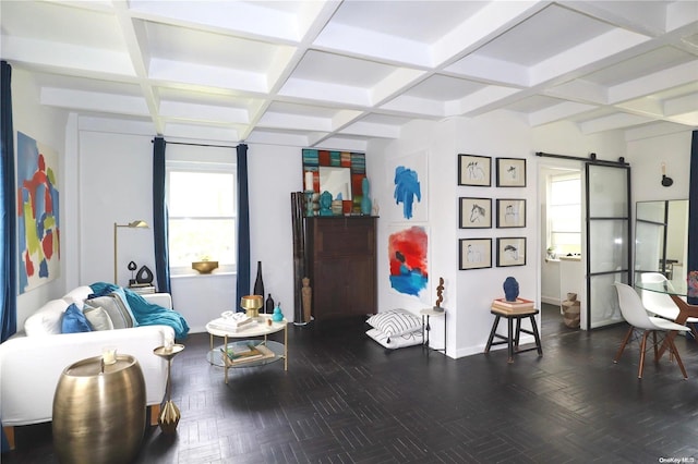 sitting room featuring a barn door, beam ceiling, and coffered ceiling