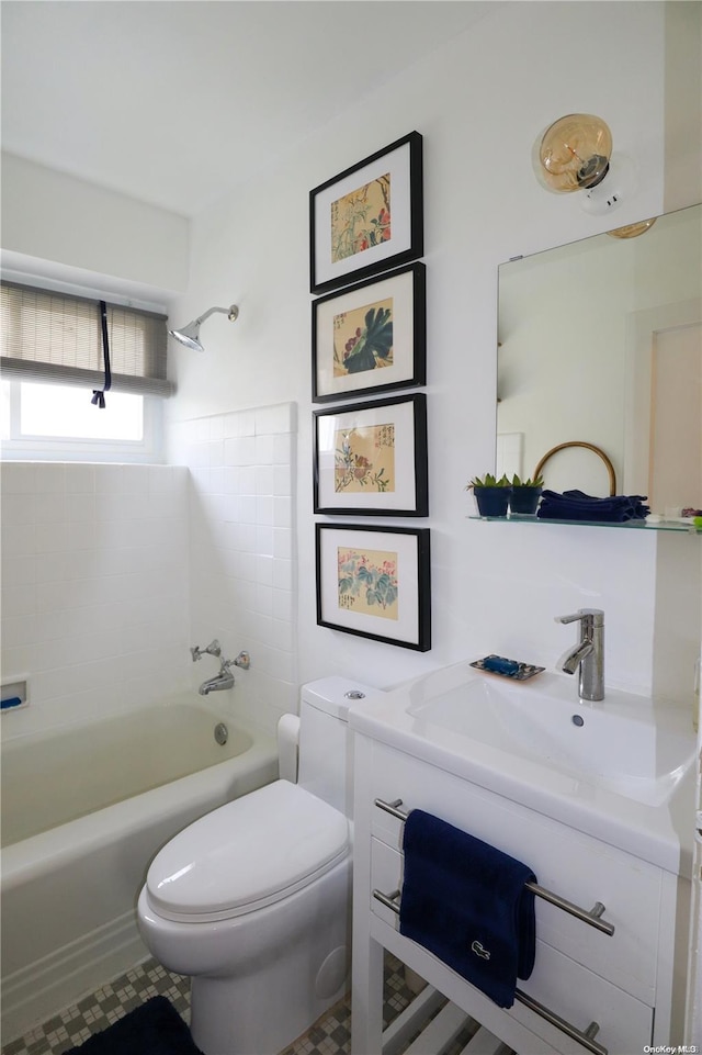 full bathroom featuring tile patterned flooring, toilet, sink, and bathtub / shower combination