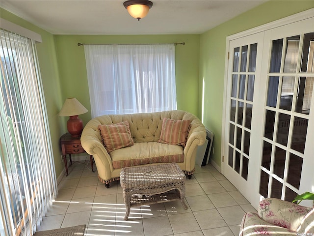 sitting room featuring light tile patterned floors and french doors