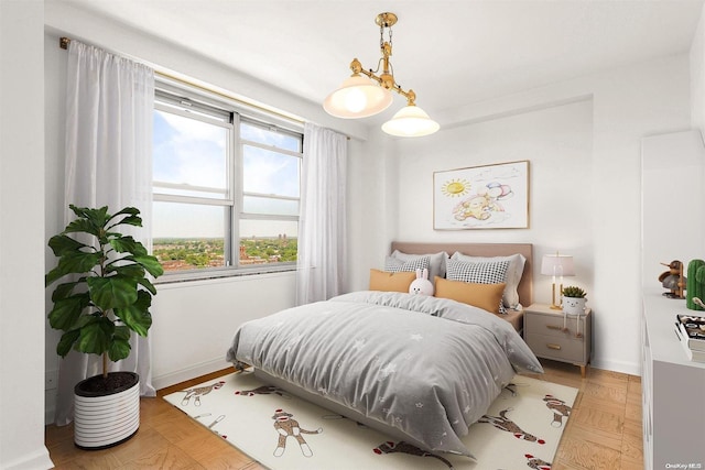 bedroom with light parquet floors