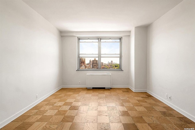 empty room featuring radiator heating unit