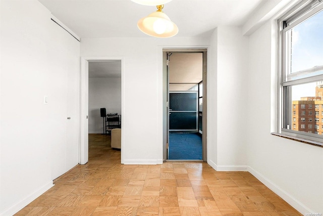 corridor featuring light parquet flooring