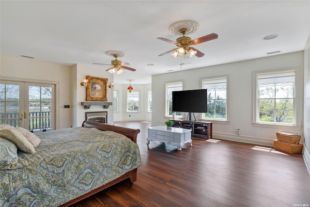 bedroom with dark hardwood / wood-style floors, ceiling fan, access to exterior, and french doors