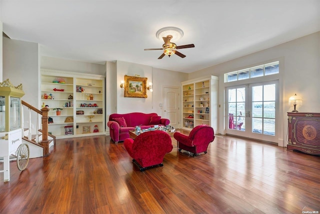 living room featuring hardwood / wood-style floors, french doors, and ceiling fan