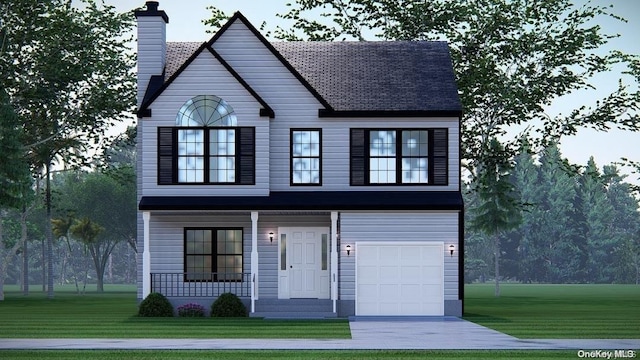 view of front of house featuring a front yard and a garage