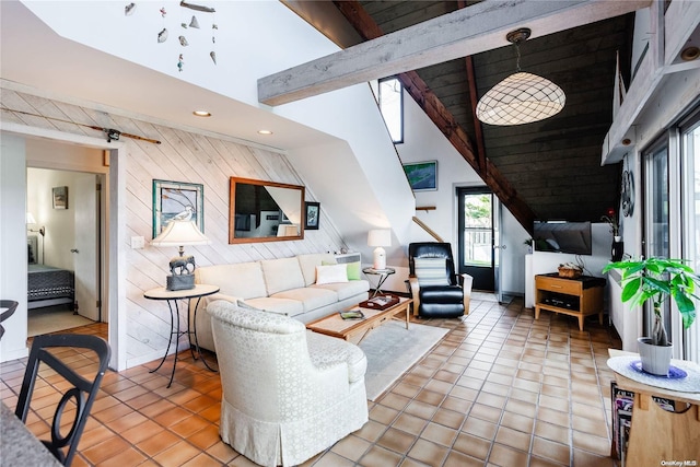 living room with beamed ceiling, light tile patterned floors, high vaulted ceiling, and wood walls