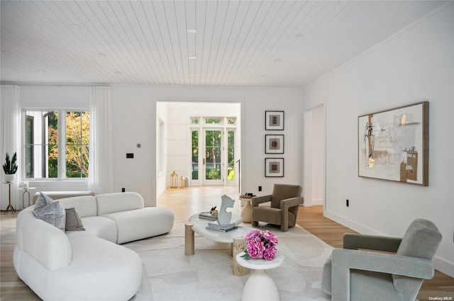 living room featuring light wood-type flooring and wood ceiling