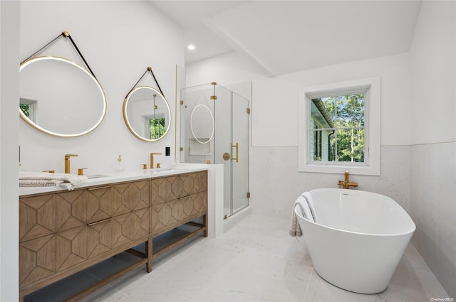 bathroom featuring vanity, shower with separate bathtub, and tile walls