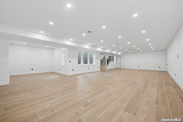 unfurnished living room with light hardwood / wood-style flooring