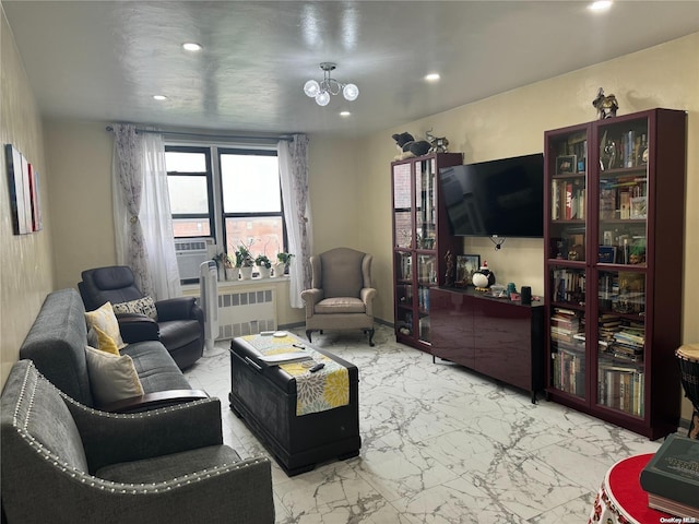 living room featuring radiator heating unit and an inviting chandelier