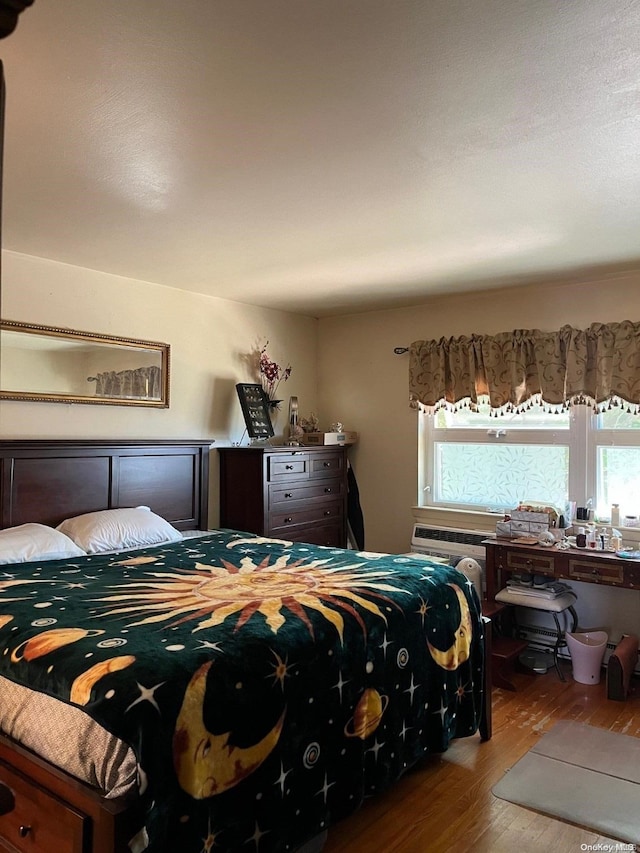 bedroom featuring hardwood / wood-style floors