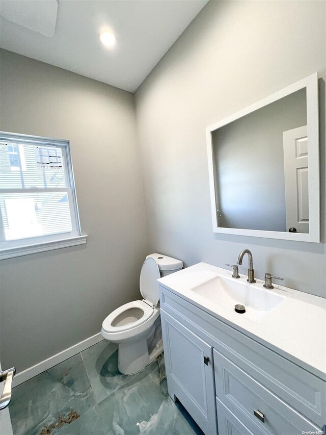 bathroom with vanity and toilet