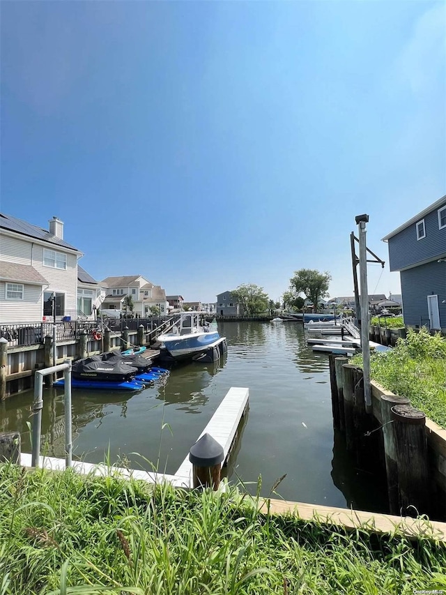 dock area with a water view