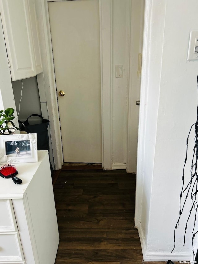 hallway featuring dark hardwood / wood-style flooring