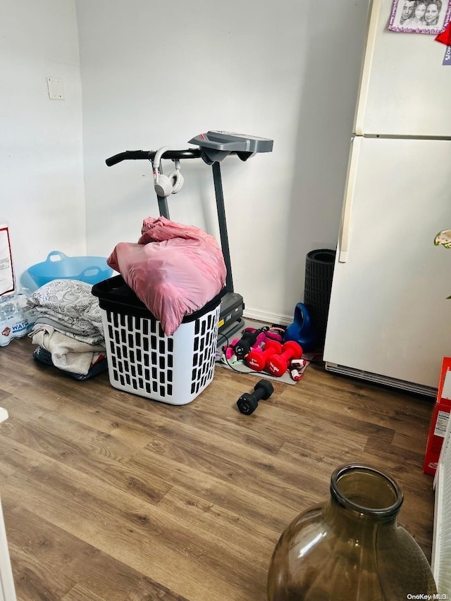 interior space featuring white fridge and wood-type flooring