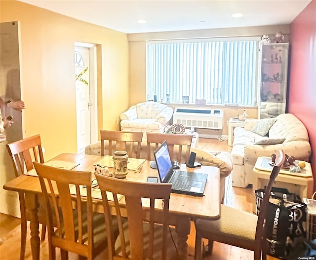 dining space with a healthy amount of sunlight and wood-type flooring