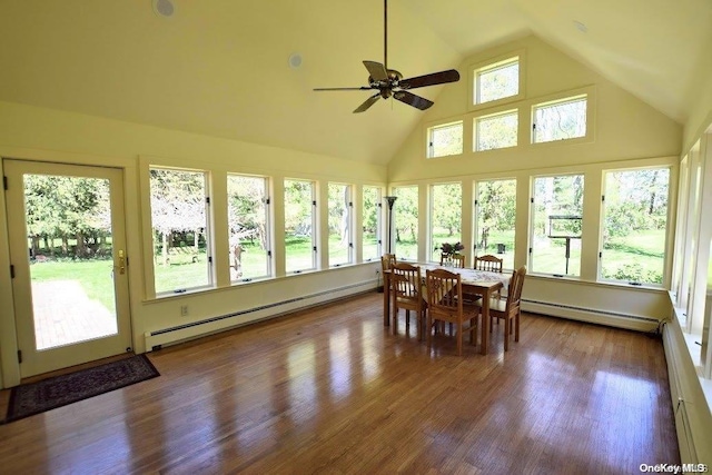 sunroom / solarium with a baseboard radiator, ceiling fan, and lofted ceiling