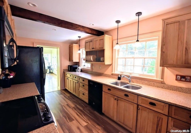 kitchen with sink, beamed ceiling, dark hardwood / wood-style floors, pendant lighting, and black appliances