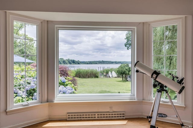 interior space featuring a water view and a baseboard radiator