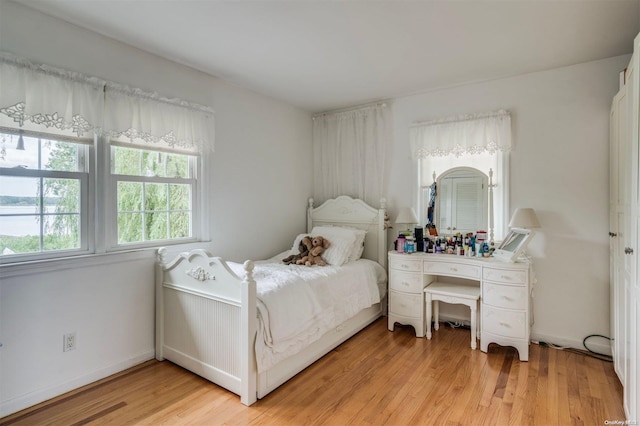 bedroom with light hardwood / wood-style floors