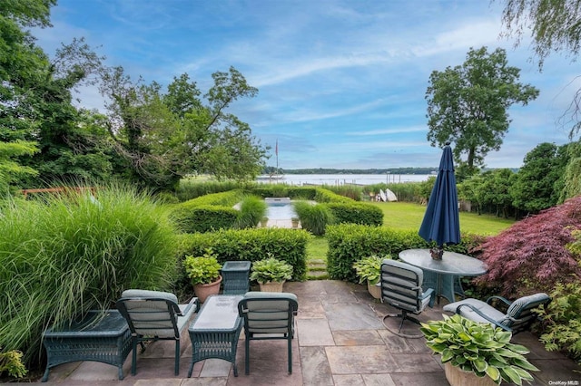 view of patio / terrace with a water view