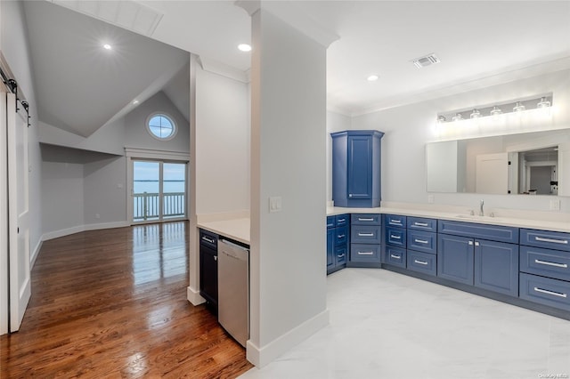 bathroom with vanity, wood-type flooring, crown molding, and high vaulted ceiling