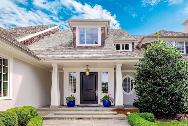 doorway to property with covered porch