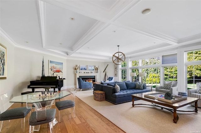 living room with beam ceiling, ornamental molding, coffered ceiling, and hardwood / wood-style flooring